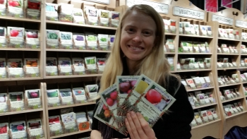 Petra Page-Mann of Fruition Seeds shows packets of regionally adapted seeds.